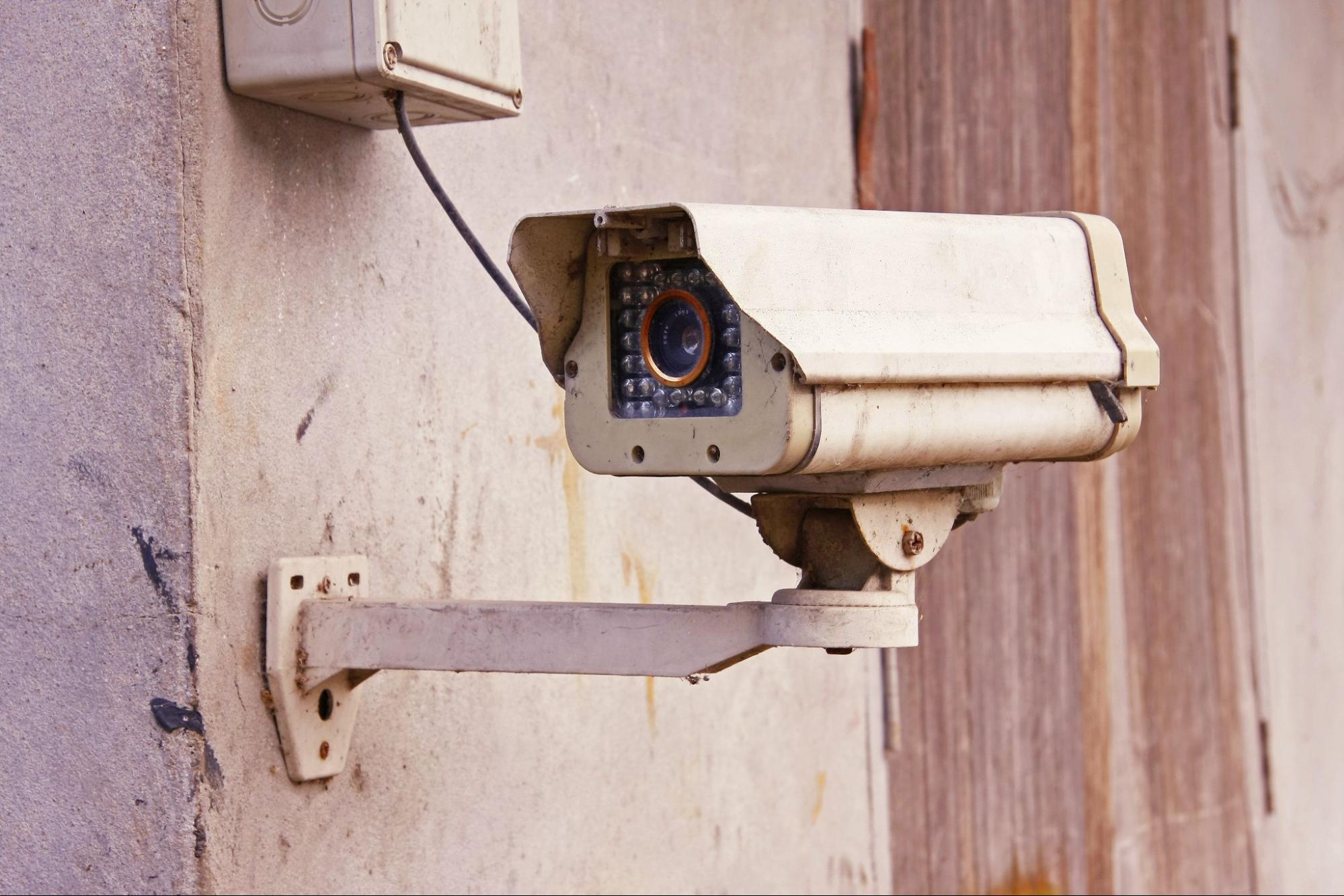 Vintage home security system with CCTV security camera on the wall